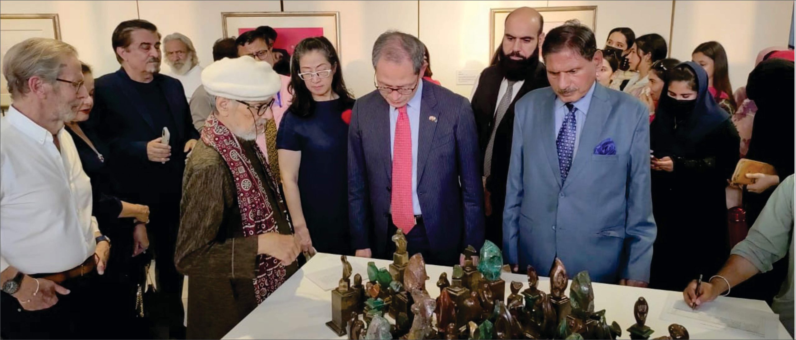 H.E. Mr. Shuichi Akamatsu, Ambassador of Japan to Pakistan, and Mr. Jamal Shah, President PJCA, view works by Ustad Bashir Ahmed at the Remains of the Ruins exhibition, SRCC, Islamabad, on September 24, 2025.
